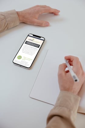 Close-Up Shot of a Person Writing Goals on a Notebook